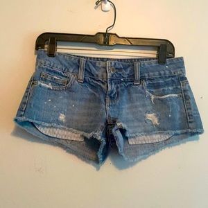 American Eagle distressed paint speckled shorts